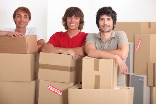 Packed office furniture and labelled boxes ready for a Belgravia business move